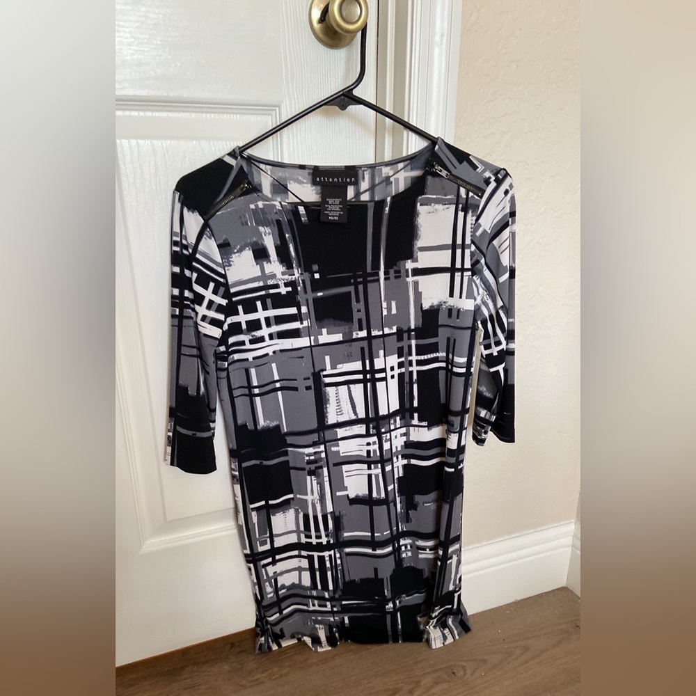 Black and white dress with 3/4 length sleeves.